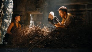 L to R: Scarlett Johansson as skilled covert operations expert Zora Bennett and Jonathan Bailey as paleontologist Dr. Henry Loomis in JURASSIC WORLD REBIRTH, directed by Gareth Edwards.